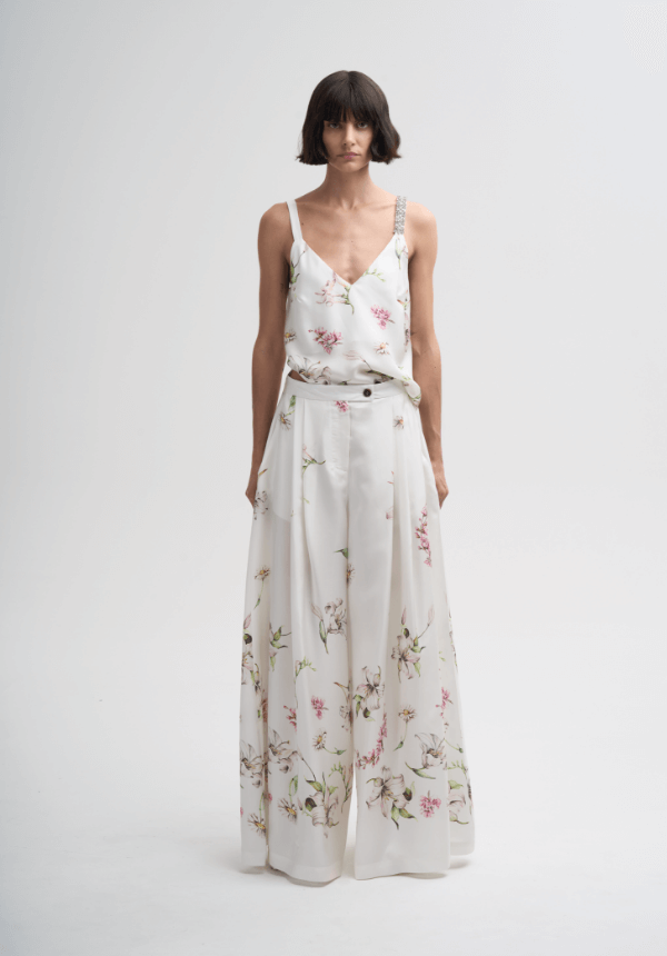 woman white and botanical prints pants and top